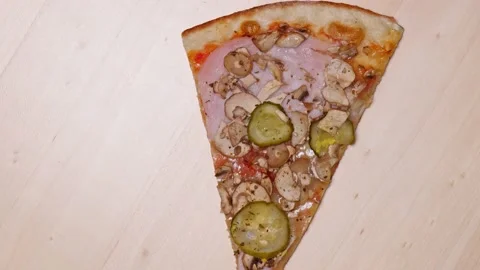 Pizza top view. Rotating a slice of pizza close-up Stock Footage 168507649