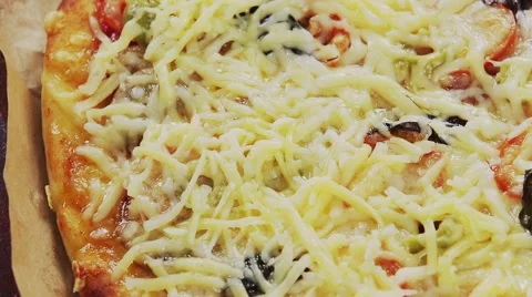 A pizza topped with mozzarella and cherry tomatoes, baking in the oven Stock Footage 67357992