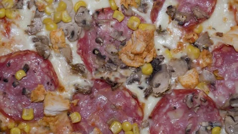 Pizza toppings texture close up for food background with salami mushrooms corn Stock Footage 336460320