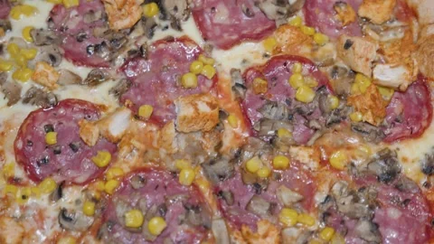 Pizza toppings texture close up for food background with salami mushrooms corn Stock Footage 336460596