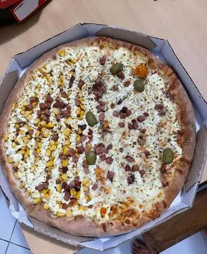 Pizza with Various Toppings Stock Photos