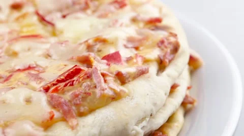 Pizza on white plate rotate closeup Video stock 53579510