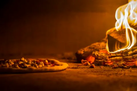 Pizza in wood fire 스톡 사진