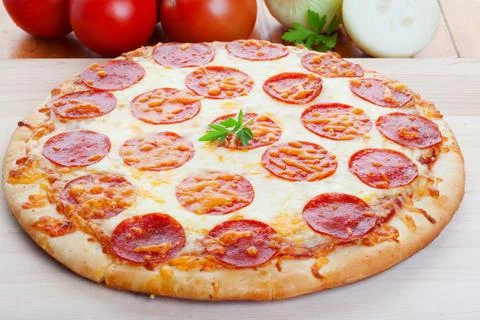 Pizza on wood Stock Photos
