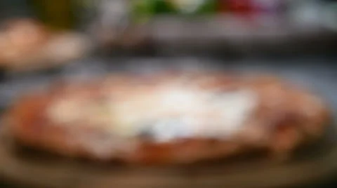 Pizza on wooden board Stock Footage 45425642
