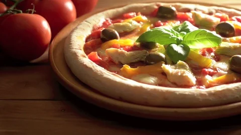 Pizza on the wooden table Video stock 74095577