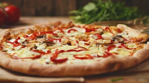 Pizza on wooden table Video stock 75175540