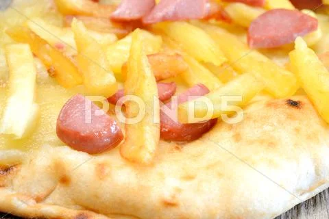 Pizza wurstel and potatoes Stock Photos