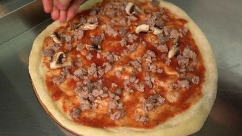 Pizzaiolo making pizza. Chef preparing pizza in the restaurant kitchen. The Stock Footage 178544145