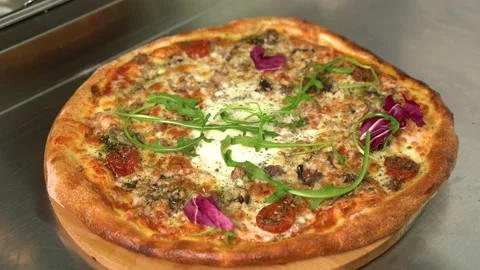 Pizzaiolo making pizza. Chef preparing pizza in the restaurant kitchen. The Stock Footage 179320442