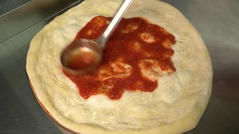 Pizzaiolo making pizza. Chef preparing pizza in the restaurant kitchen. The Stock-Footage 179350561