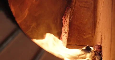 Pizzaiolo prepares pizza over an open flame in a stone oven. Traditional Italian Stock Footage 272632999
