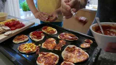 Pizzas topped with corn and tomatoes Stock Footage 56757537