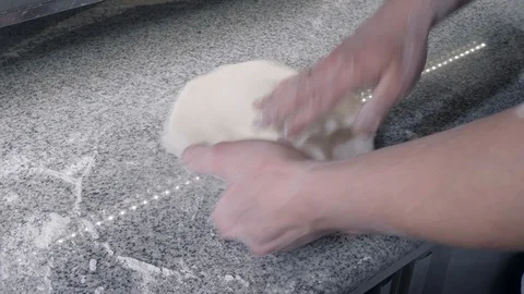 Pizzeria chef turns raw thin dough making pizza on table Stock Footage 127215010