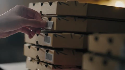 Pizzeria, Shef chef baker Carefully glues barcode pizza box at baker's workp Stock Footage 243900882