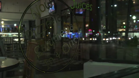 Pizzeria Window with Text Decal at Night Stock Footage 342563075
