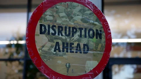 A Placard Reads “Disruption Ahead” On A Protest Against The Shell Oil And Gas Stock Footage 310536357