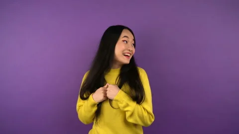 Place in the background for animation. smiling young Asian woman in a bright Stock Footage 144452253