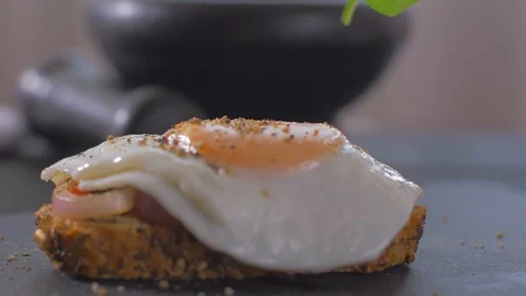 Place basil on sandwich with egg Stock-Footage 109550785