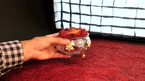 Place a beautiful container of saffron on the saffron background Stock Footage 171235130