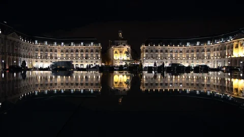 Place de la Bourse square in Bordeaux, France reflecting in water at night 스톡 동영상 129373298