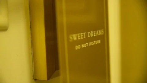 Place Do Not Disturb Hanger on Knob Stock Footage 79537469