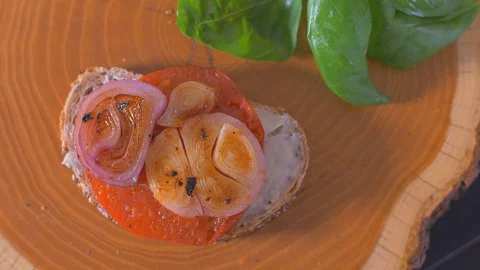 Place an egg on a sandwich. Appetizing Stock Footage 109552826