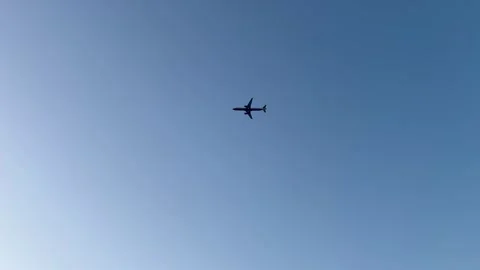 A place flying over in a blue evening sky Stock Footage 277084080