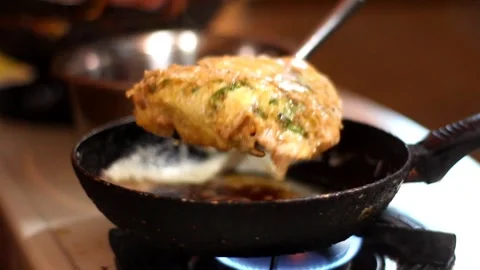 Place a frying pan with fried eggs mixed. Stock Footage 273122385