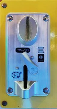 A place to insert coins in a game machine. Stock Photos