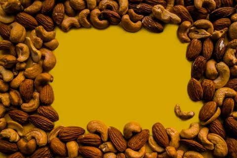 Place to insert in the middle, surrounded by cashews and almonds. Stock Photos