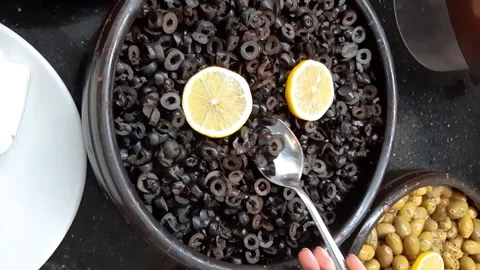 Place olives on a plate Stock Footage 252030255