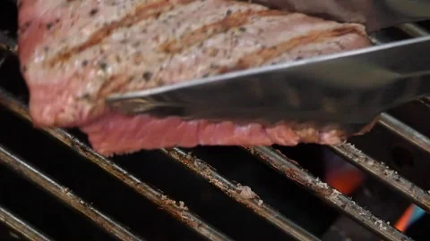 Place one beef tournedos on BBQ grate Stock-Footage 114183239