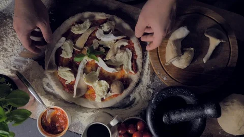 Place the pizza on a baking pan Stock-Footage 108145339