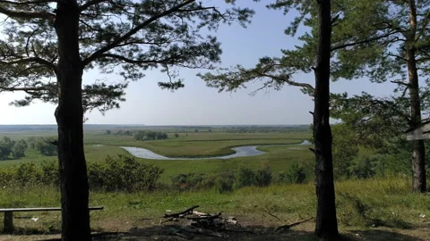 A place to rest in the forest with an excellent view of the river Stock-Footage 92999731
