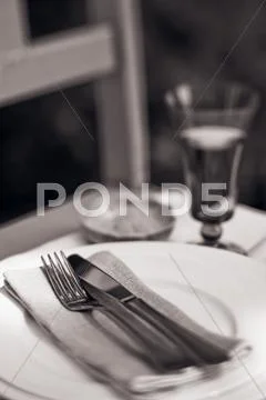 Place-Setting And Glass Of Wine