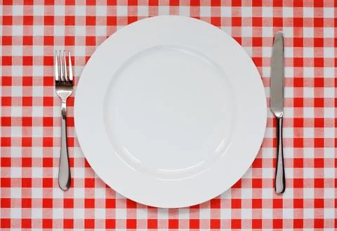 Place setting on red gingham tablecoth Stock Photos