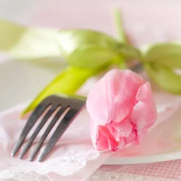 Place setting with tulip and fork, selective focus Stock Photos