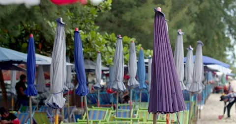A place to sit on the beach. In the evening, the umbrellas that shade the sun. Stock Footage 250598101