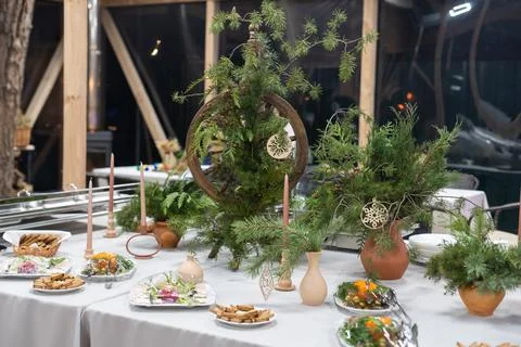 Place table setting for Christmas white table with decor elements with green Stock Photos