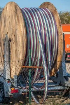 On a place there is a big cable drum Stock Photos