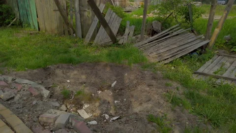 Place where the shell hit and the destroyed building nearby. Russian invasion Video stock 197109553
