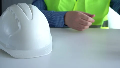 Place the white work helmet on the table. 스톡 동영상 157500816