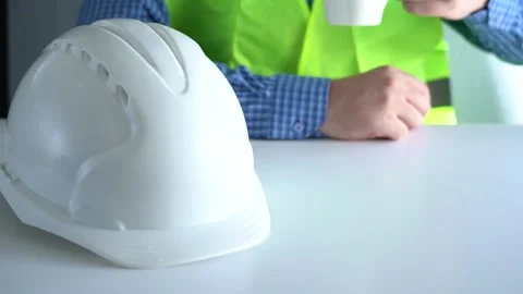 Place the white work helmet on the table. Stock Footage 167551257