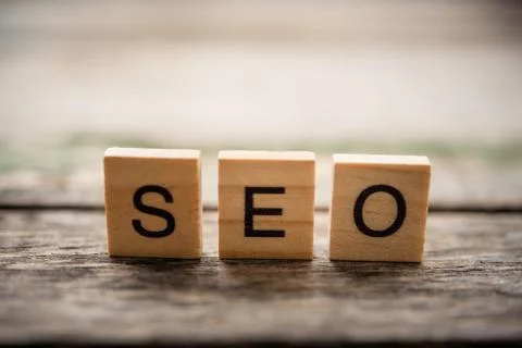Place the word "S E O" on the wooden floor - concept Search Engine Optimizati Stock Photos