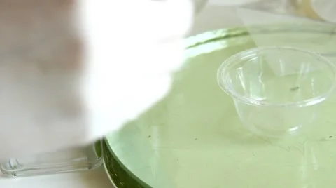 Placement blue liquid in a laboratory dish Stock Footage 8690737