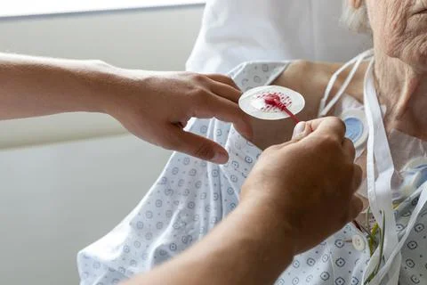 Placement of an electrode in an elderly patient Stock Photos