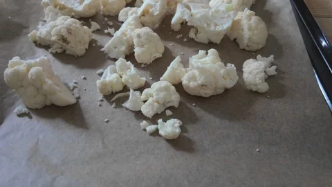 Placing and Preparing Fresh Cauliflower Florets on Baking Sheet - Food Prep.. Stock Footage 327392509