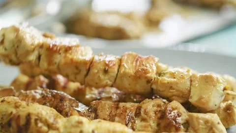 Placing another skewer on the plate. Stock-Footage 207024561