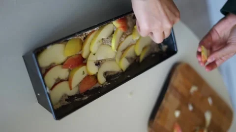 Placing apples in a mold vertical video Stock Footage 258416218